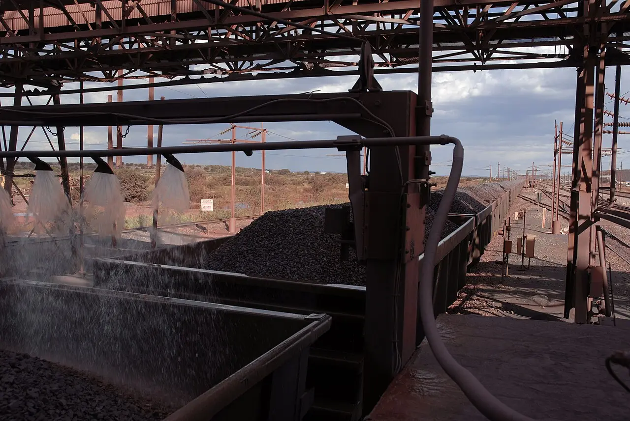Iron ore loaded into rail wagons at Sishen mine